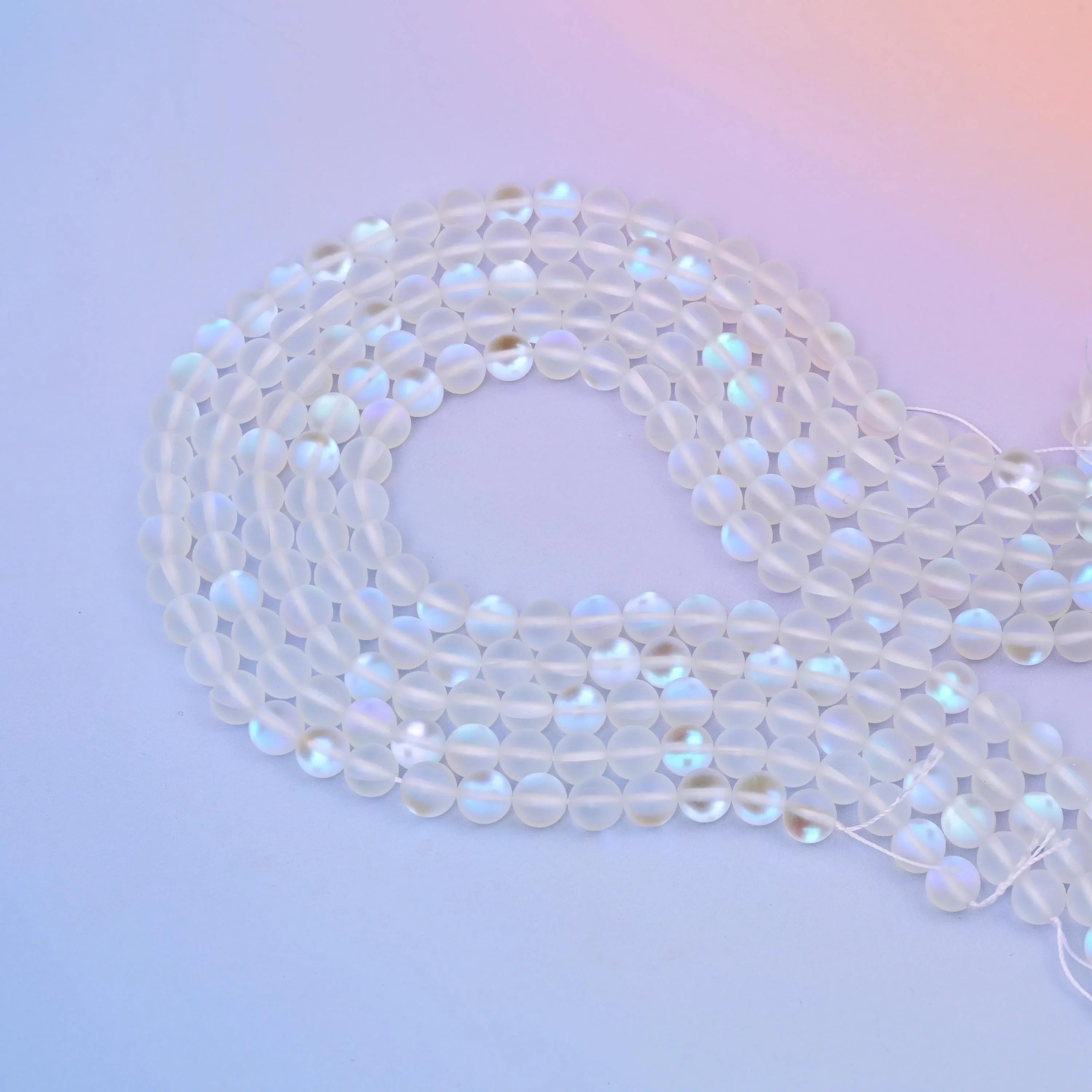Mystic Aura Mermaid Clear Glass Beads 6mm 8mm in frosted clear with pink and blue iridescence