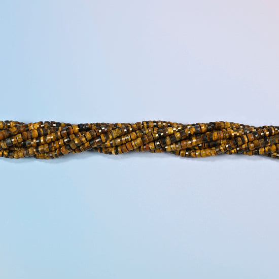 Strands of tiger eye faceted heishi disc beads twisted together in a horizontal row