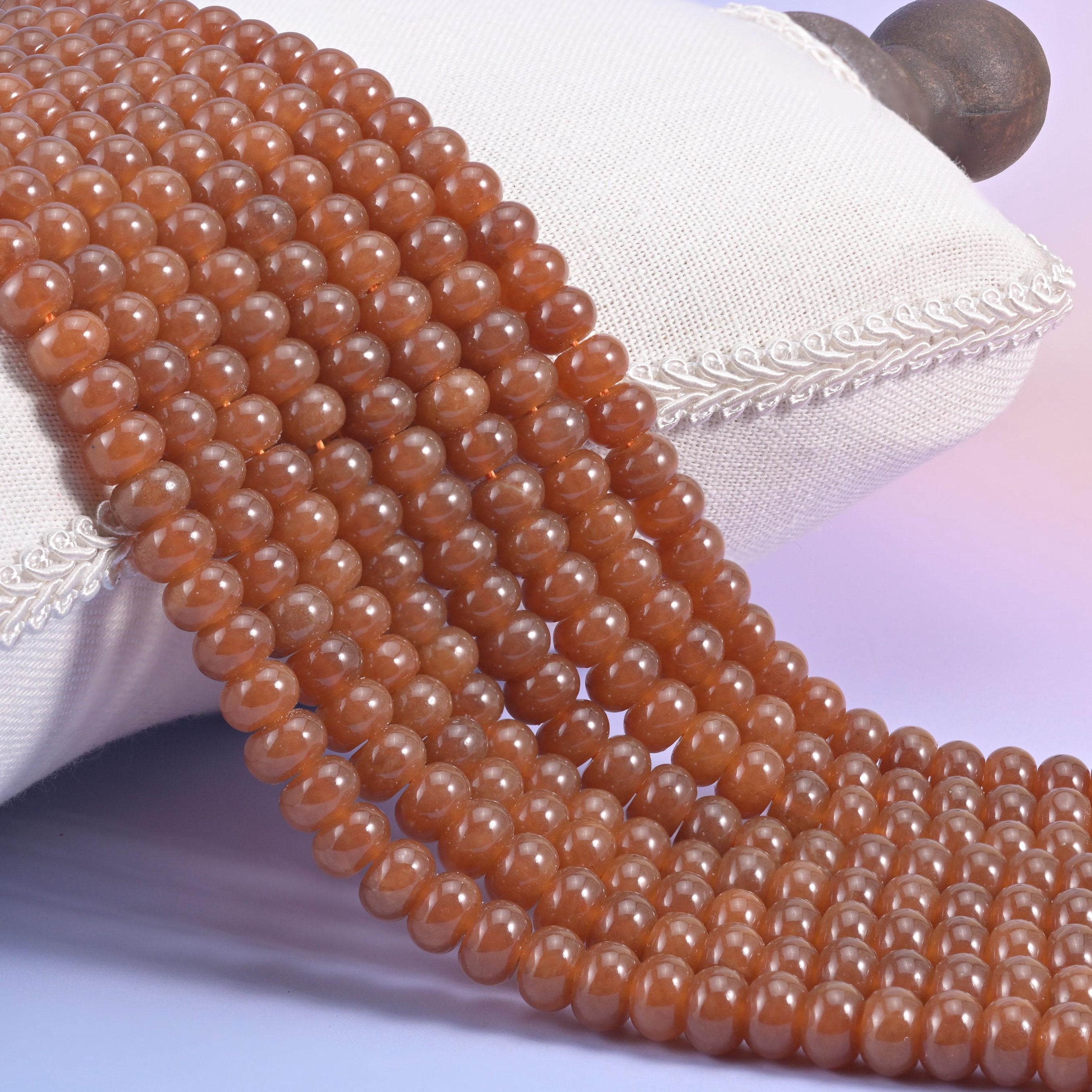 Caramel Dyed Jade smooth rondelle beads in a warm, glossy amber-brown