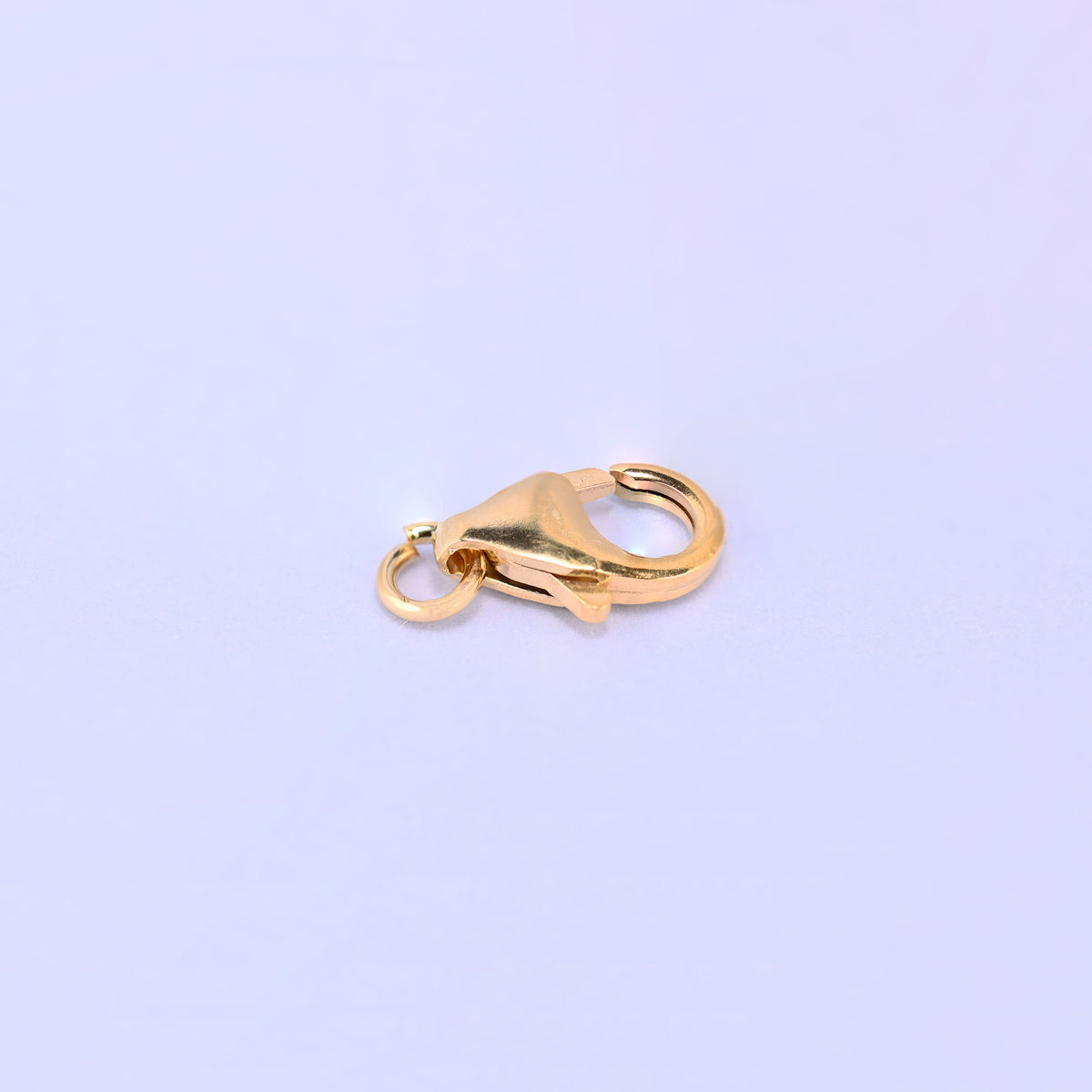 14K gold filled lobster clasp, 6x10mm, close-up of the trigger and hinge with the jump ring at the right