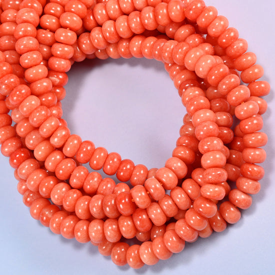 Red Orange dyed jade gemstone rondelle beads coiled into a ring, even warm orange across the whole strand