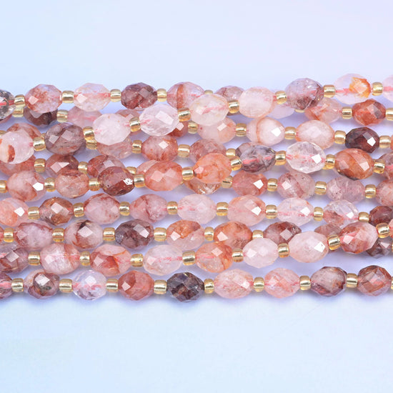 Faceted rice barrel cut red hematoid beads