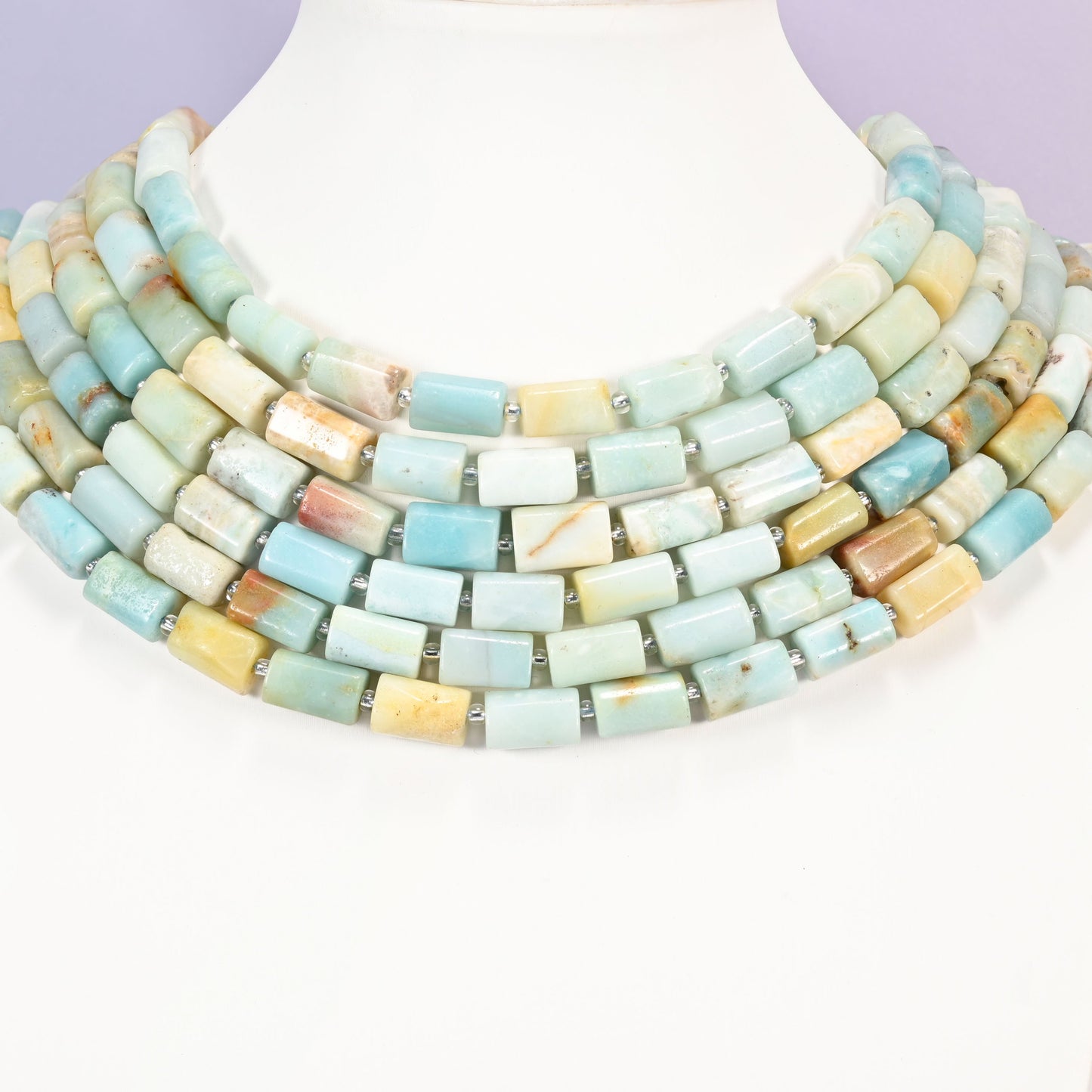 Multi-Color Amazonite faceted tube beads laid in four graduated collar rows, 12x8mm tubes in blue, green, cream and yellow