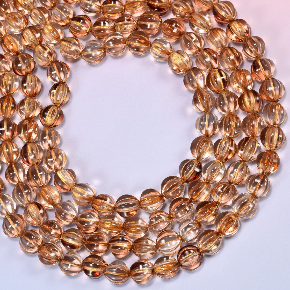 Mystic Aura Brown pumpkin glass beads coiled into a wide open ring, fluted grooves catching the light.