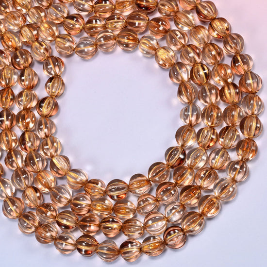 Mystic Aura Brown pumpkin glass beads coiled into a wide open ring, fluted grooves catching the light.