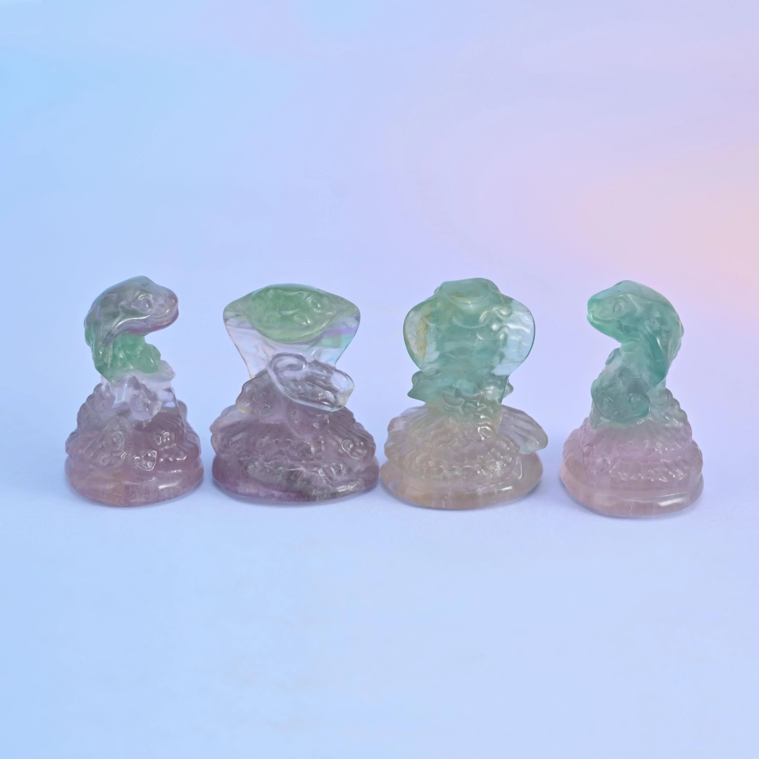 Natural fluorite gemstone animal carving, cobra snake design.
