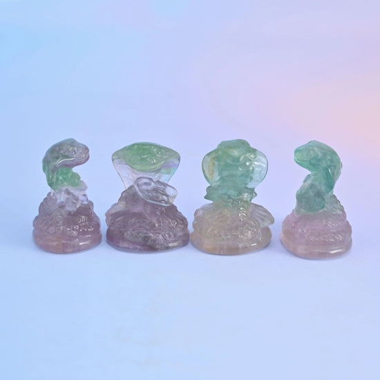 Natural fluorite gemstone animal carving, cobra snake design.