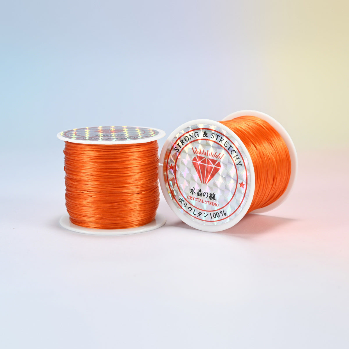 Two rolls of dark orange 0.7-0.8mm elastic stretch string, glossy polyurethane bead cord with a holographic label