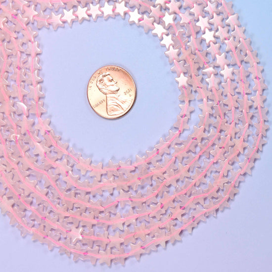 Rose quartz flat star beads, approximately 75 per strand