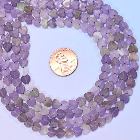 Matte amethyst flat heart-shaped beads with purple and lavender color variation, ideal for dangle earring designs