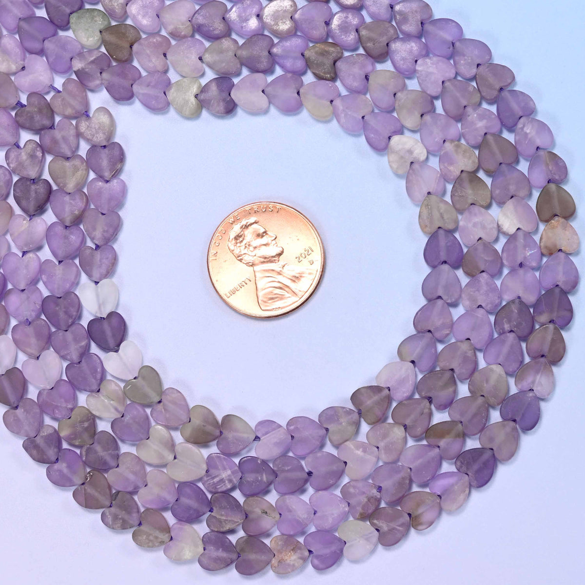 Matte amethyst flat heart beads, approximately 68 per strand