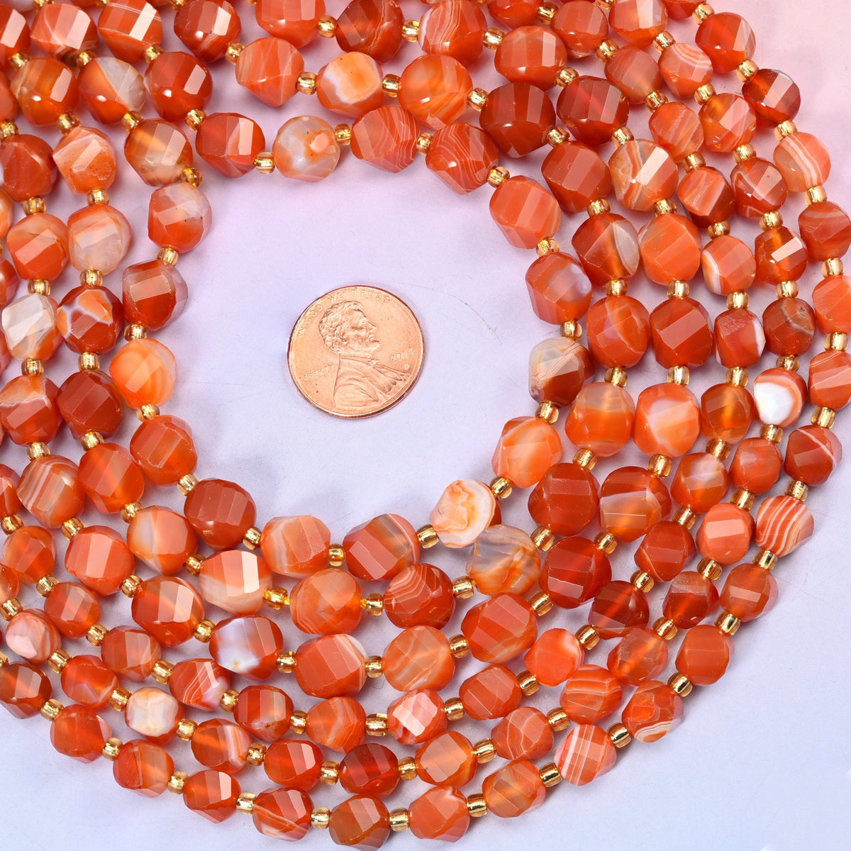 Dyed Red Stripe Agate Faceted Spiral Twist Beads, warm brick and terracotta red banded with cream and pale peach stripes