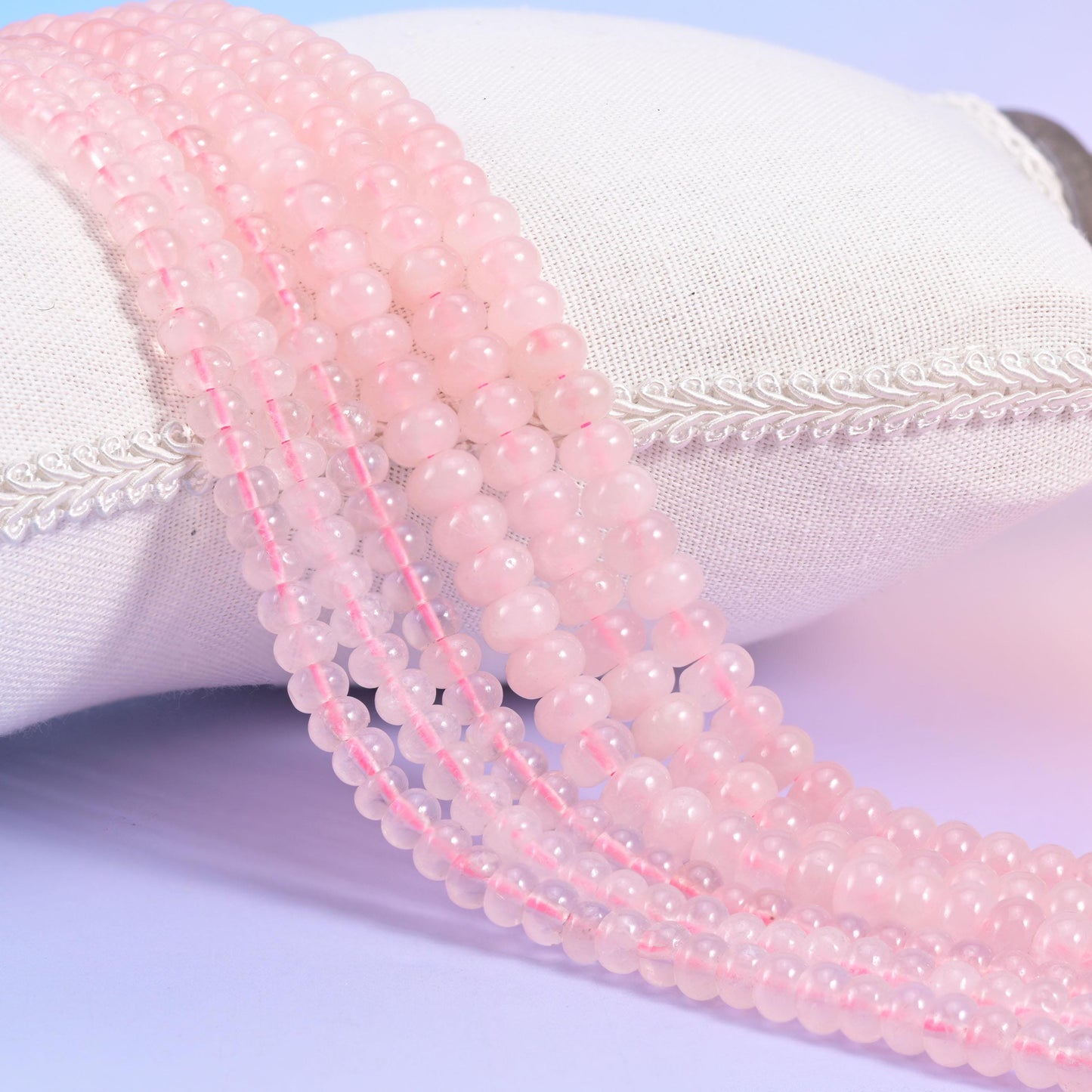 Natural Rose Quartz smooth rondelle beads in soft blush pink with a gentle translucent glow