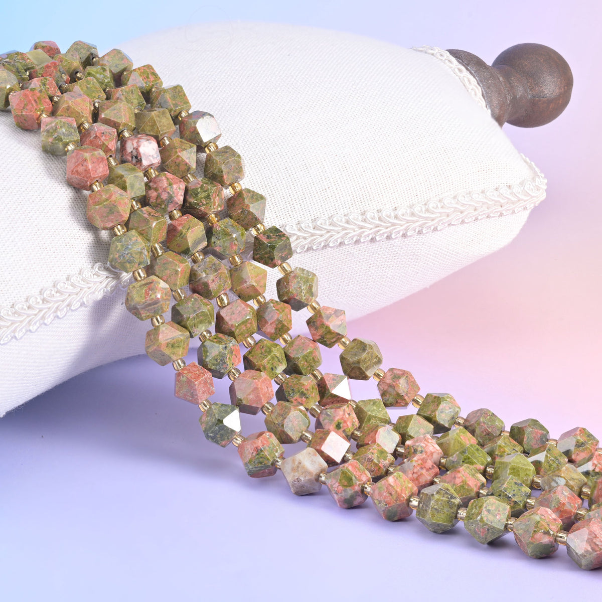 Faceted rhombus gemstone beads, deep violet and sea-green among the colourways offered.