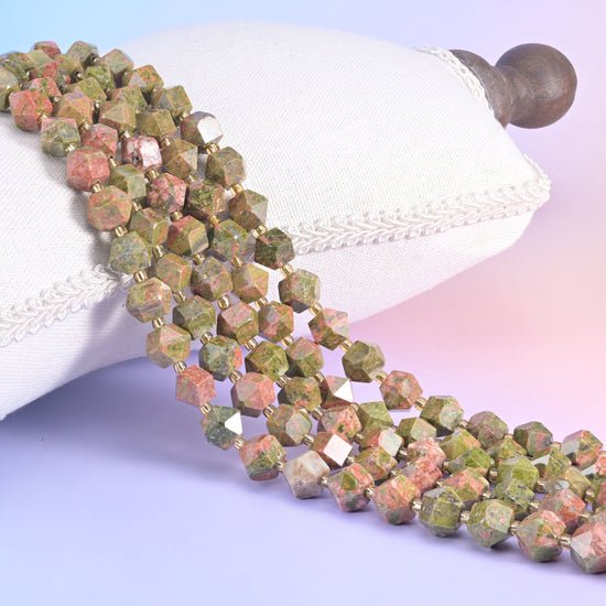 Faceted rhombus gemstone beads, deep violet and sea-green among the colourways offered.