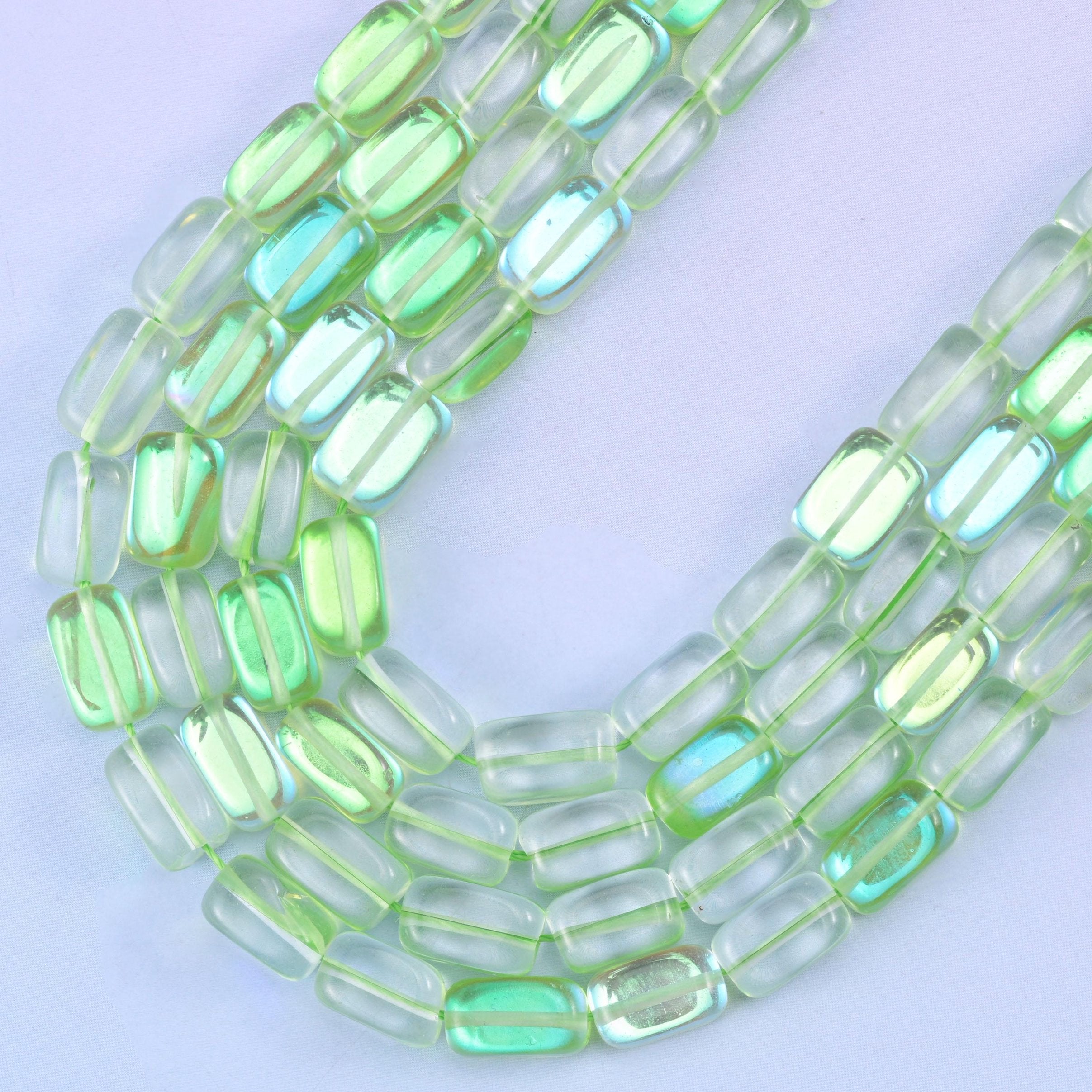 Green Mystic Aura glass beads, center-drilled approximately 1.0mm hole