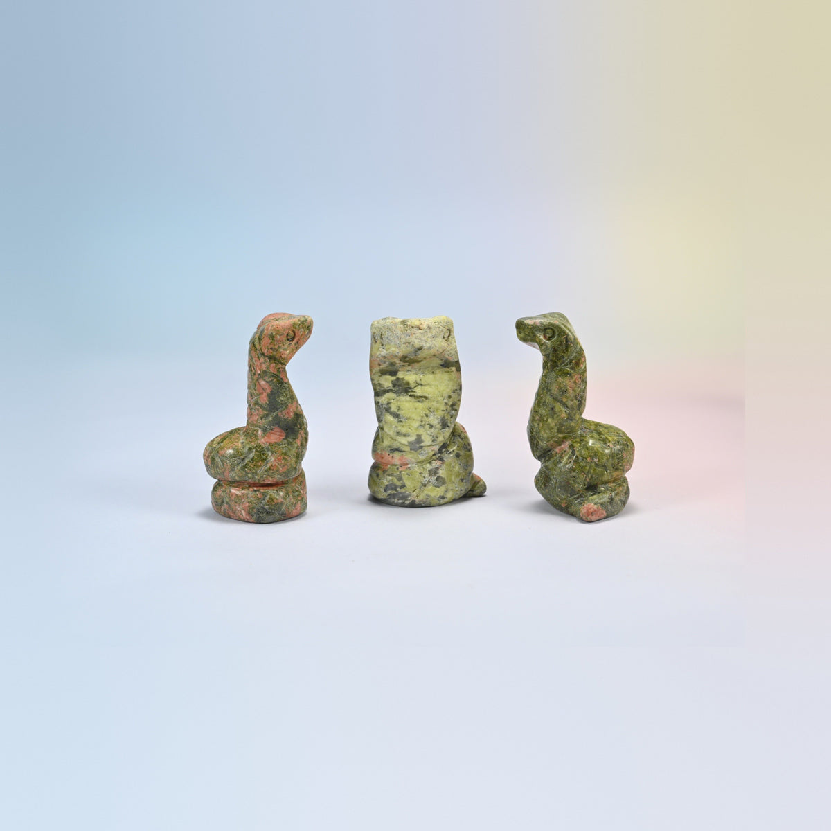 Cobra snake crystal carving in unakite, green and salmon pink natural stone