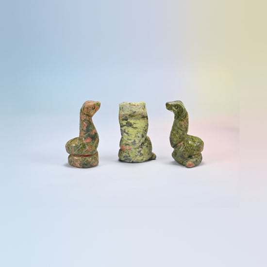 Cobra snake crystal carving in unakite, green and salmon pink natural stone