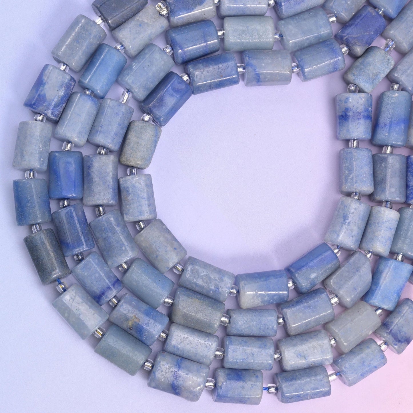 Coiled ring of blue aventurine tubes, the rectangular beads angling around the loop