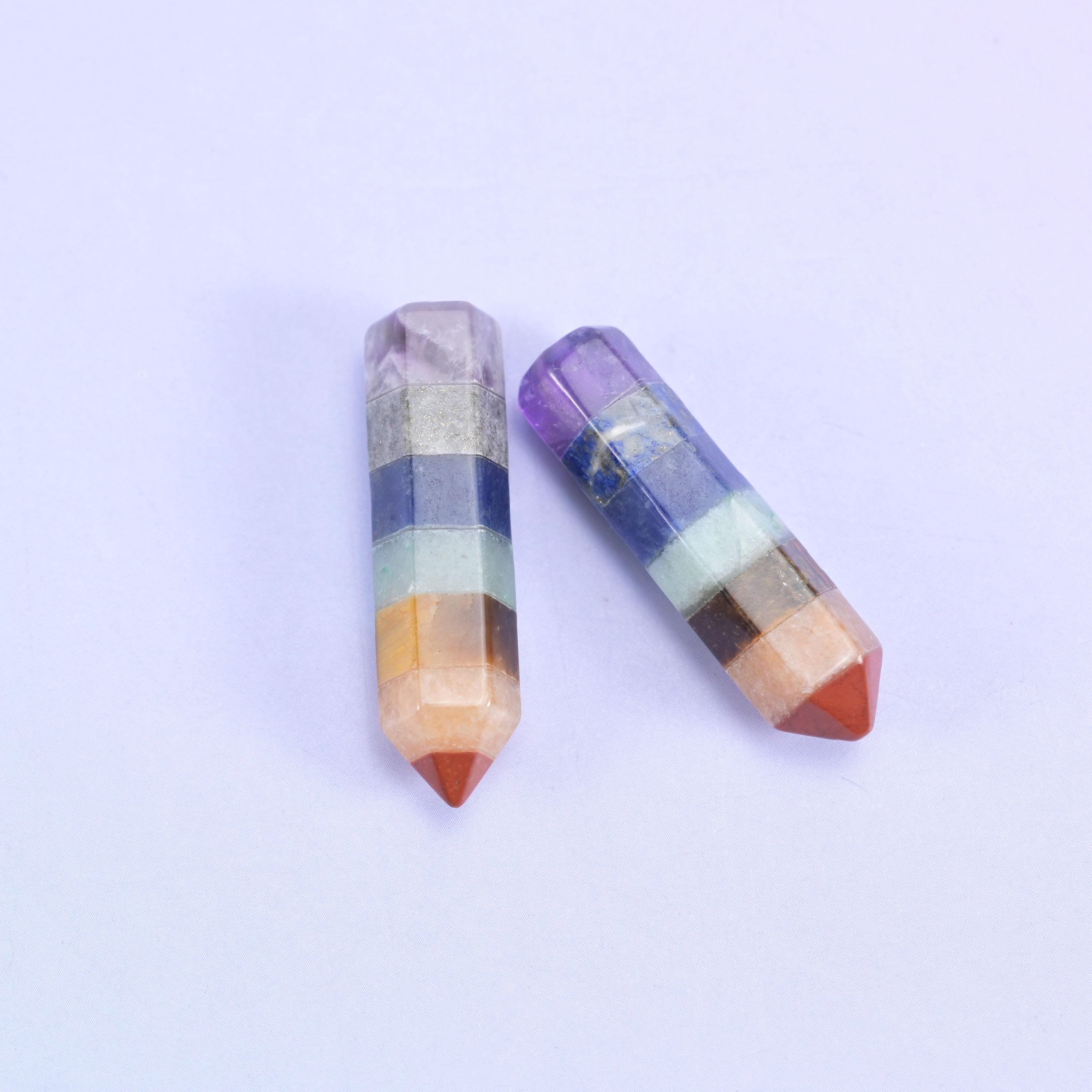 Two hexagon towers, one single point and one double terminated, banded in violet, cream and orange