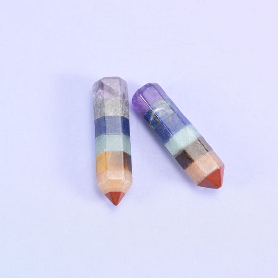 Two hexagon towers, one single point and one double terminated, banded in violet, cream and orange