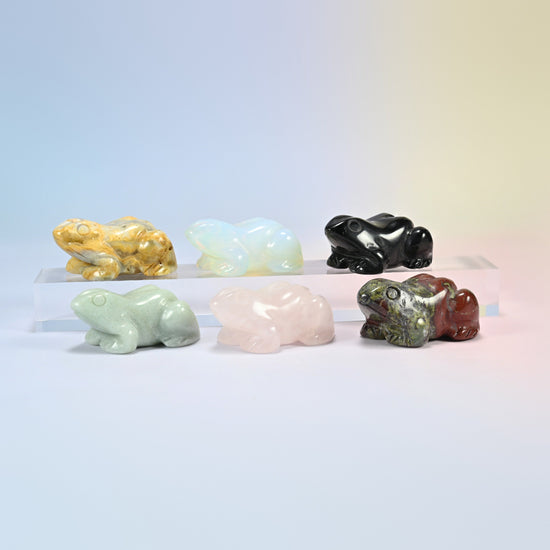 Six frog crystal carvings in natural crazy agate, black obsidian, green aventurine, rose quartz, dragon bloodstone and opalite