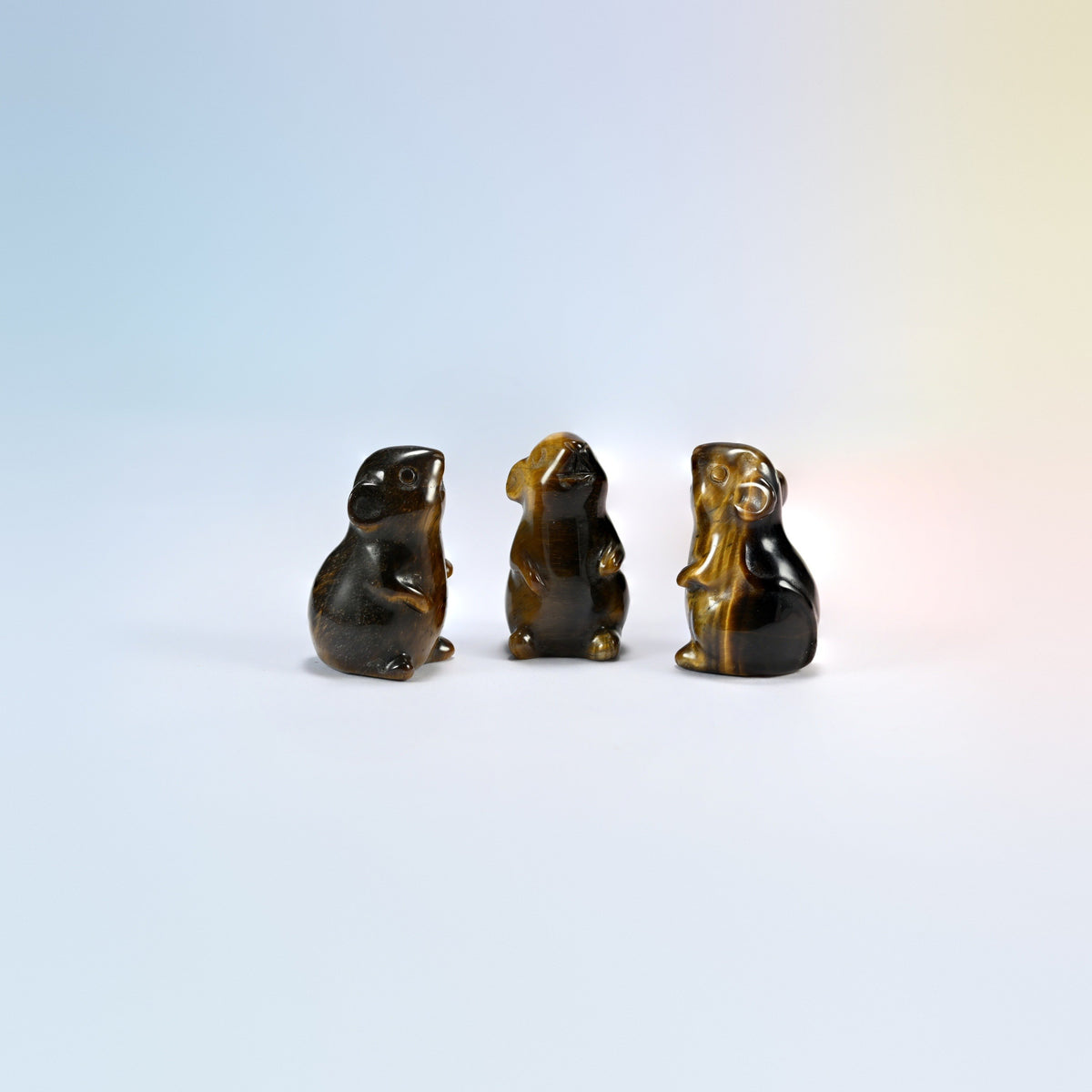 Three natural tiger eye mouse crystal carvings, 1.5 inch, golden brown