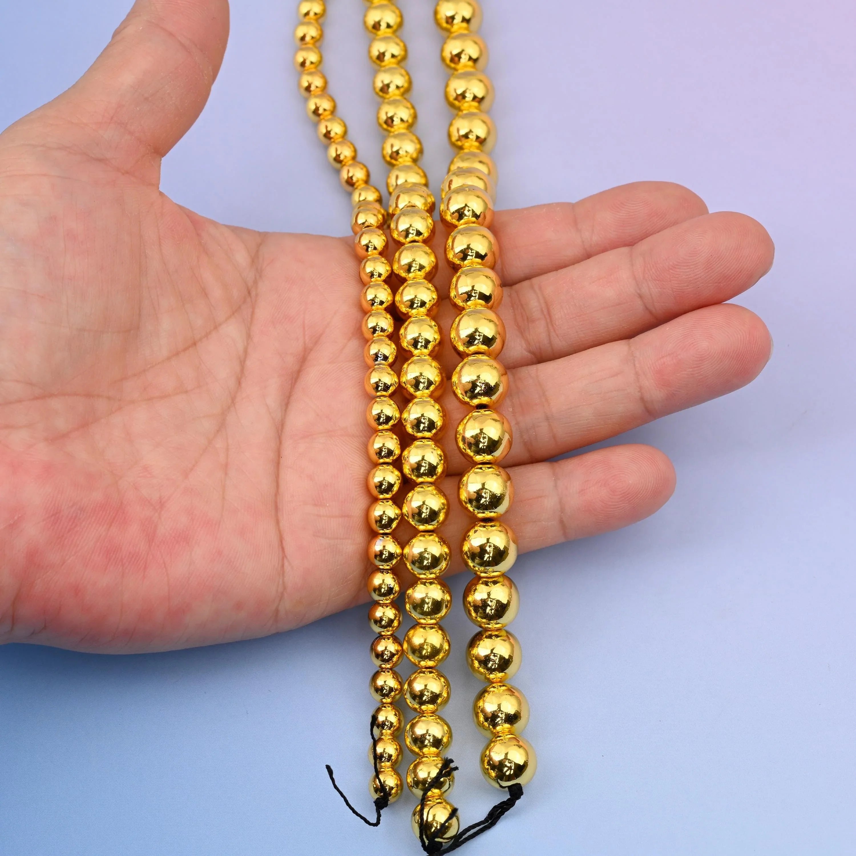 Titanium gold plated hematite beads, round shape, 4mm to 10mm.