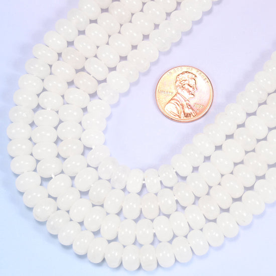 Rondelle cut Natural White Jade beads with a soft translucent glow.
