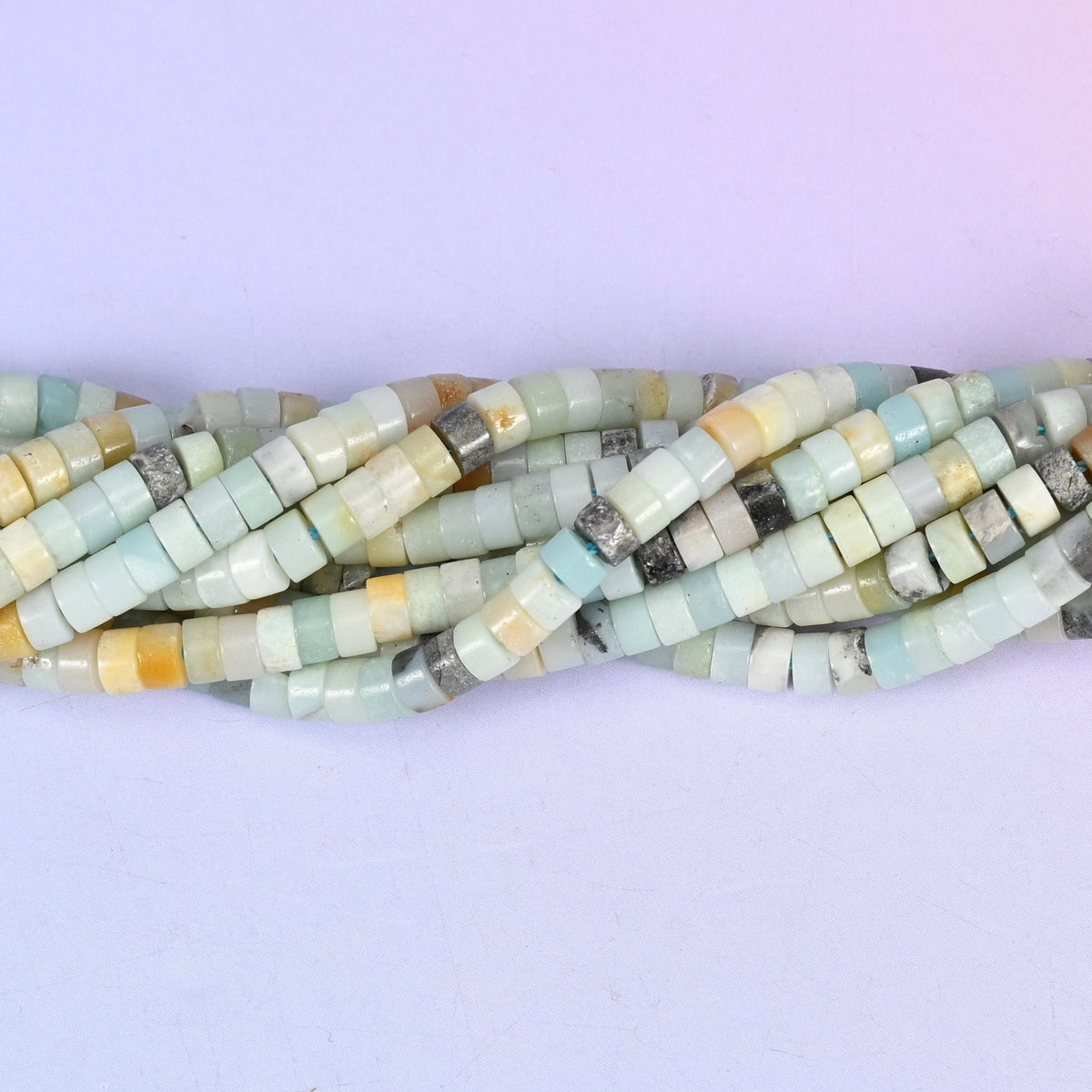 Natural Multi-Color Amazonite smooth heishi disc beads in a soft mix of seafoam, cream, gray, and warm amber tones, finished with a polished, sophisticated look.