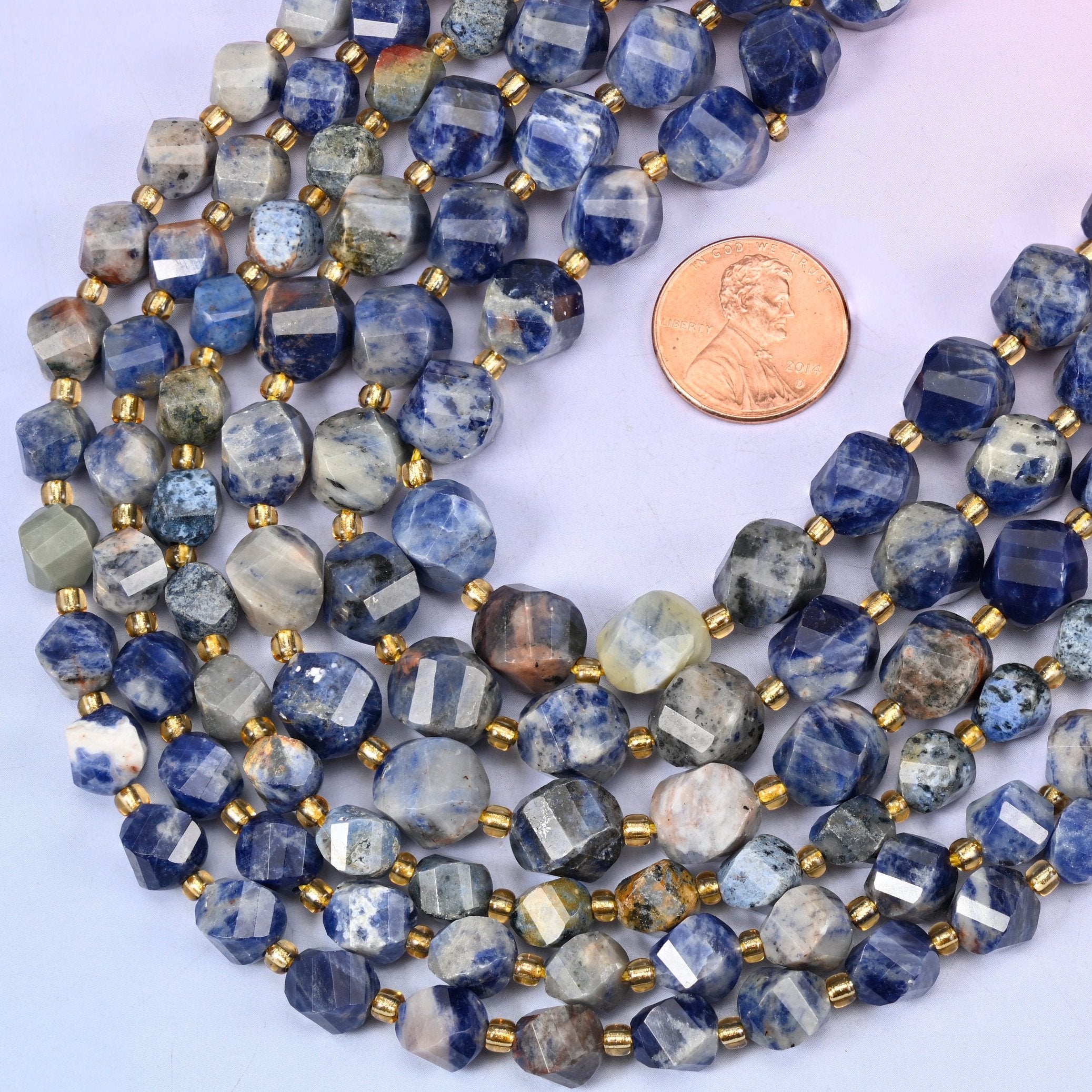 Faceted spiral twist cut Orange Sodalite beads