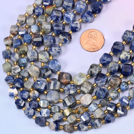Faceted spiral twist cut Orange Sodalite beads