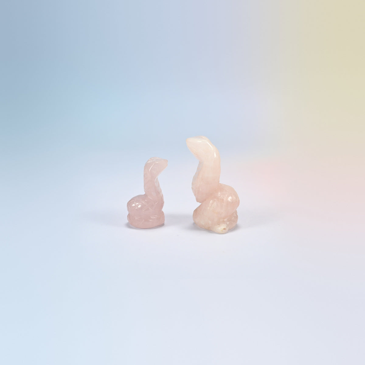 Cobra snake crystal carving in rose quartz, light pink natural stone