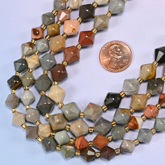 Close-up of American Picture Jasper faceted bicone beads, 8mm and 10mm, in a loose curved strand, showing the tan, brown and rust color variation.