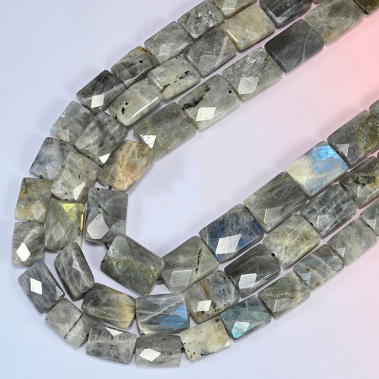 Gray Labradorite faceted flat rectangle beads curving in a long loop, whole tile faces lighting up blue