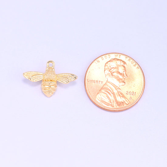 Small gold charms bee shown beside a US penny for scale, 18K gold plated 17x11.7mm charm