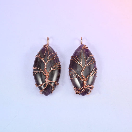 Oval Crystal Pendant with Copper Wired Tree in deep purple amethyst, two pieces where the dark stone throws the copper branches into relief.