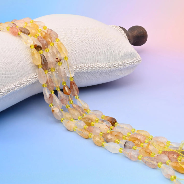 Natural Golden Healer quartz faceted teardrop beads, pale champagne with warm amber clouding