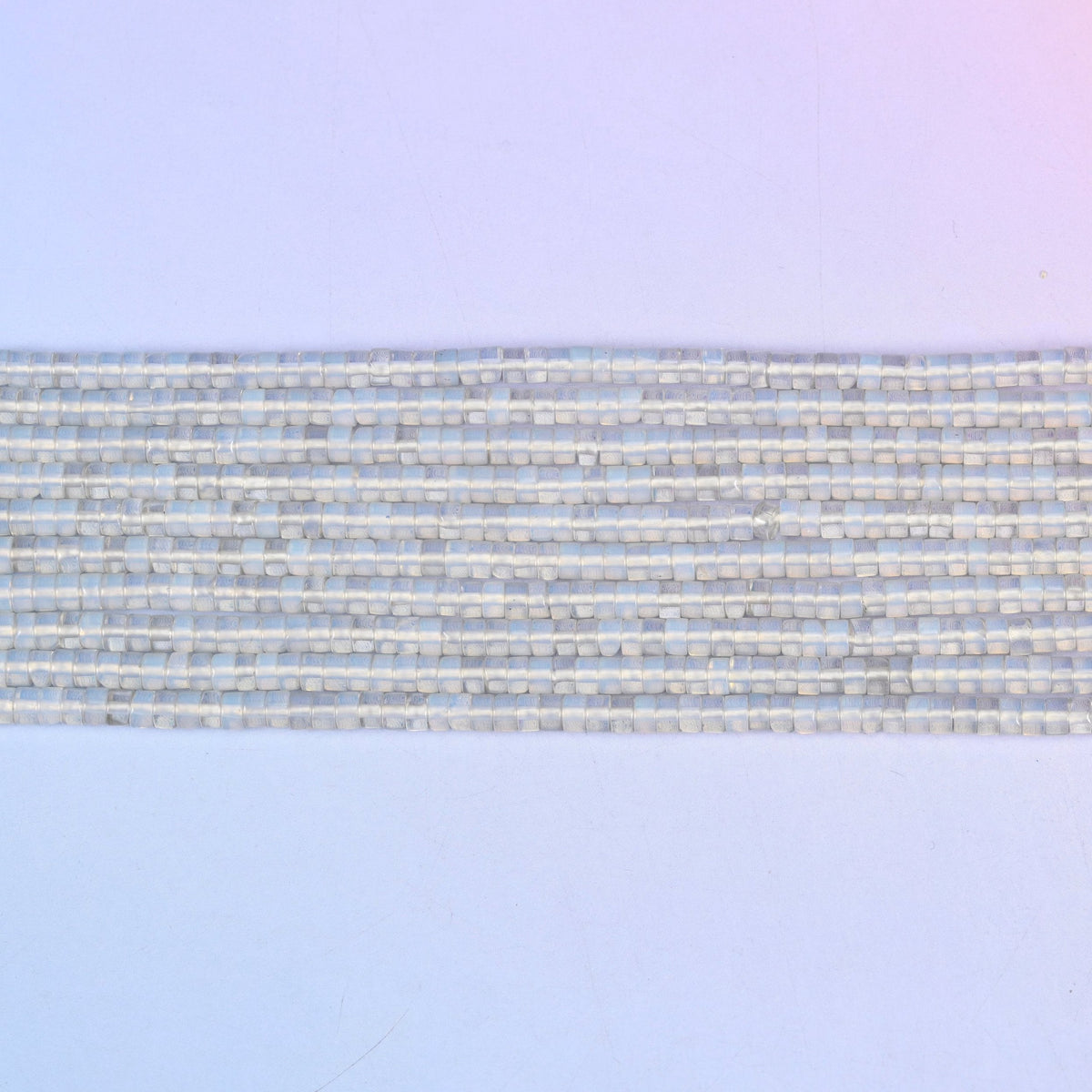 Opalite Smooth Heishi Disc Beads in soft milky-blue
