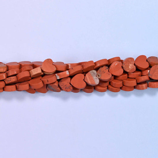 Matte red jasper flat heart beads, approximately 68 per strand