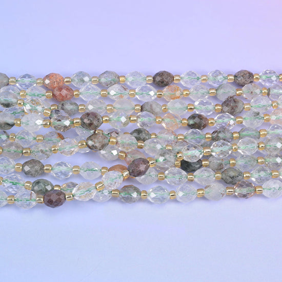 Faceted rice barrel cut green phantom quartz beads