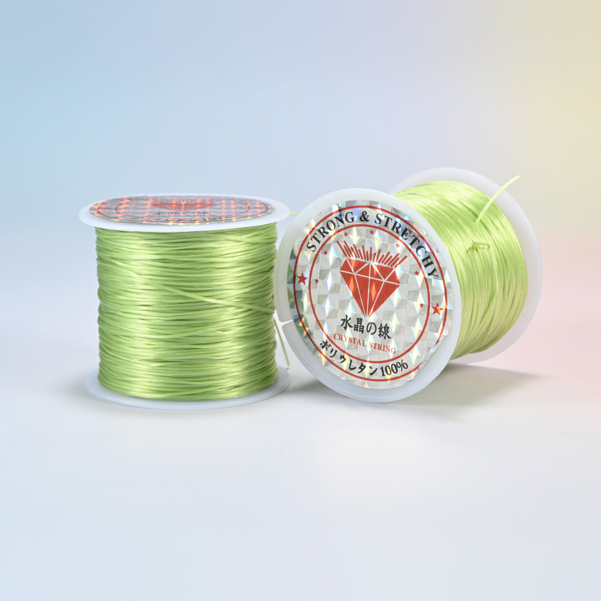 Two rolls of light green 0.7-0.8mm elastic stretch string, glossy polyurethane bead cord with a holographic label