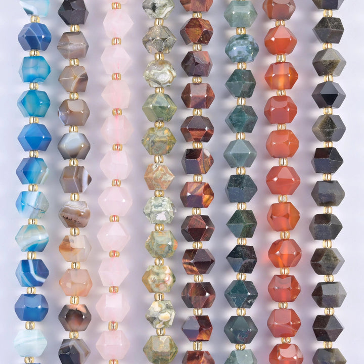 Faceted eight-sided diamond rhombus beads with flat planes meeting at a ridge