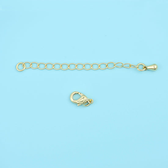 A short run of open oval links in warm gold, with a lobster clasp at one end and a small tag at the other. Add it to a finished necklace to gain length
