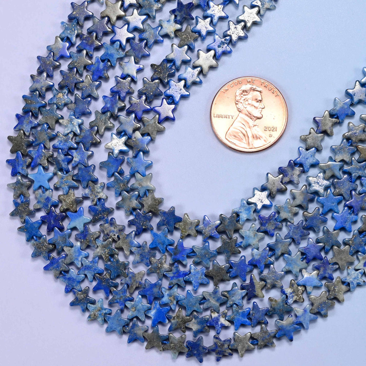 Flat star cut lapis lazuli beads