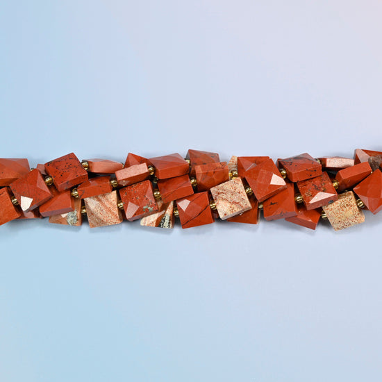 Strands of natural flower red jasper faceted flat square beads twisted together in a horizontal row