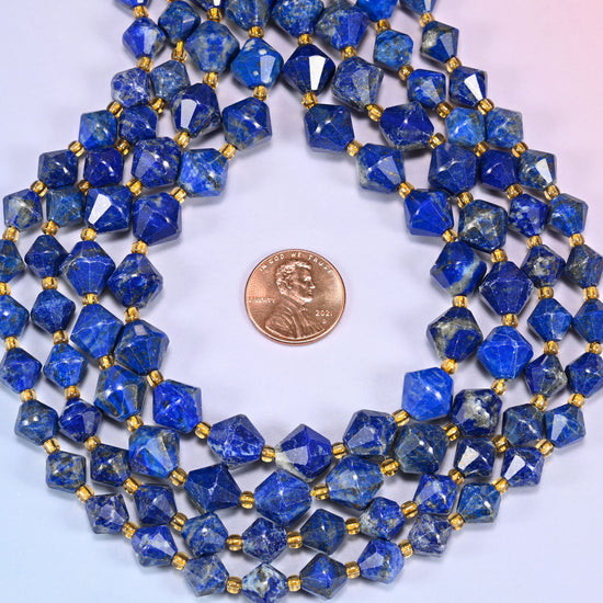 Lapis lazuli bicone beads coiled into a ring, seen from above, mottling different on every bead.