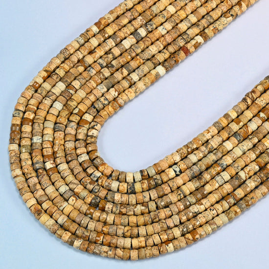 Picture jasper faceted heishi disc beads in several strands curved into a wide U, tan and beige stone with brown patterns