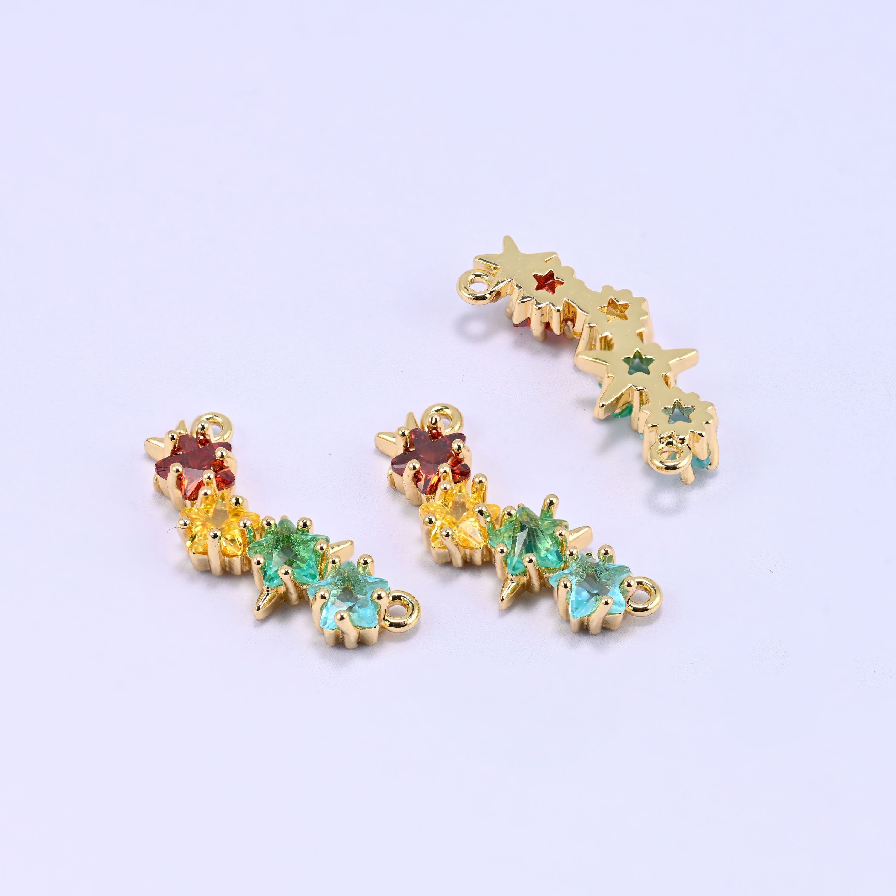 Gold bar connector with four star-cut multicolour zircon stones