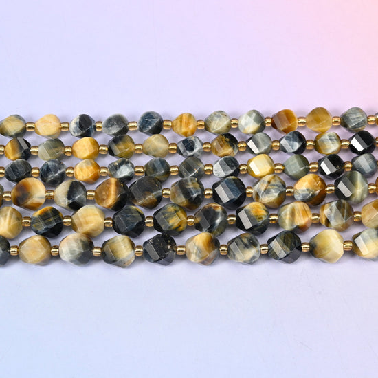 Dream Tiger Eye beads banding honey gold against steely blue-grey and near-black
